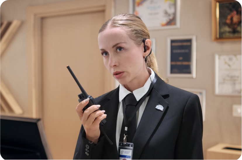 AIG Security courtesy attendant at a lobby front desk